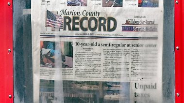 Last weeks edition of the Marion County Record on sale in the street box in front of the newspaper office