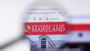 University of Maryland, College Park website homepage logo visible on computer screen
