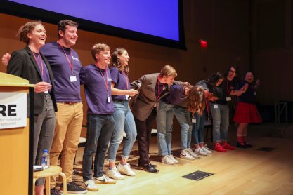 2022 Intern Class taking a bow after leading a session at the Summer Conference