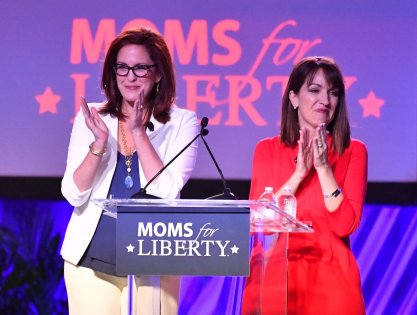 Moms for Liberty co-founders Tiffany Justice, left, and Tina Descovich, greet attendees as they open the first Moms for Liberty National Summit on Thursday, July 15, 2022 in Tampa, Florida. The convention continues through Sunday, July 17th with conservative speakers and strategy sessions for members.