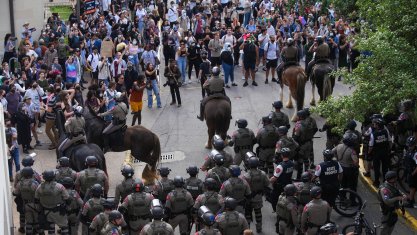 Mounted state police confront protestors at University of Texas at Austin