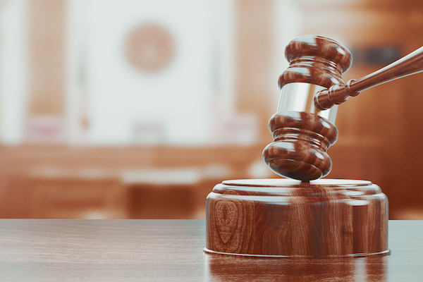 Wooden gavel on table close up.