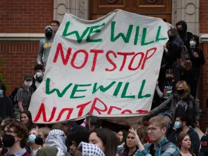 Pro-Palestinian protesters march down East 13th Ave during a rally on the University of Oregon campus in support of a cease fire in Gaza.