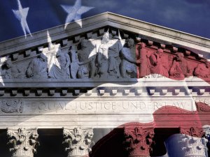 Digital composite of the Supreme Court Building and American flag