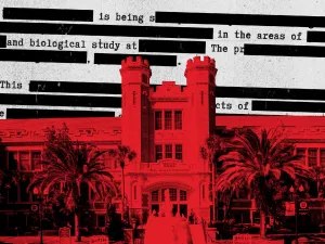 Image of campus building in red with redacted text in the background