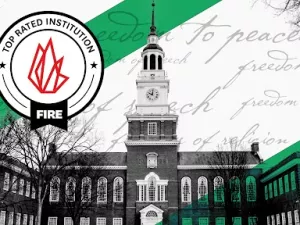 Baker Memorial Library at Dartmouth College with green stripes in the background, indicating the school has received a "Green Light" speech code rating from FIRE.