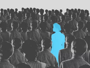 Blue silhouette pf person standing in monochrome crowd of people