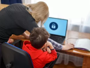 Mother locking on computer for son, parental control