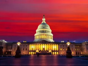 The United States Capitol building at sunset at night in Washington DC