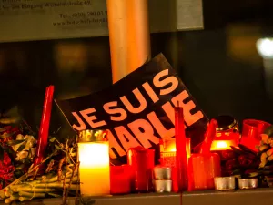 Sign reading Je Suis Charlie at a memorial for the victims of the Charlie Hebdo magazine terror attacks in 2015