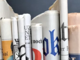 A stack of rolled up newspapers 