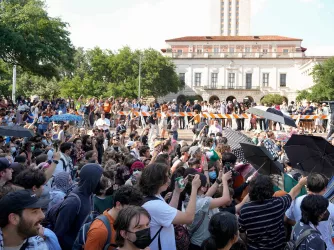 Pro-Palestinian protesters march at the University of Texas Monday April 29, 2024.