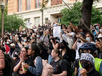 Students watch and participate in a pro-Palestinian protest at the University of Texas Wednesday April 24, 2024