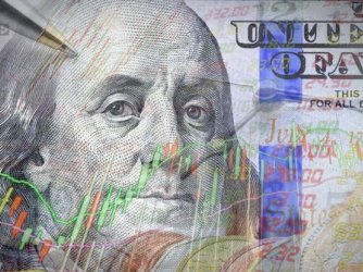 Hundred dollar bill overlaid with digital graphs