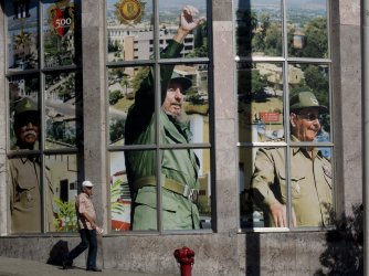 Portrait of Fidel Castro and his brother Raul in the center of the town in Santiago de Cuba