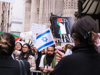 Pro-Israeli and pro-Palestinian protesters gather in front of the CUNY grad center in New York city.