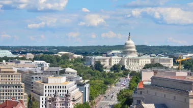 Aerial view of Pennsylvania street with federal buildings including US Archives building, Department of Justice and US Capitol