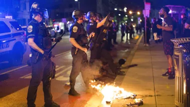 Police form line in the street during protests in D.C. on the night of May 31, 2020