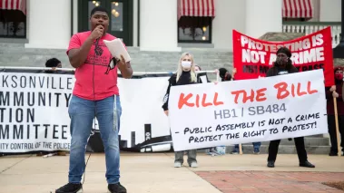 Protestor in Tampa Bay speak during a protest in front of the Florida Historic Capitol 