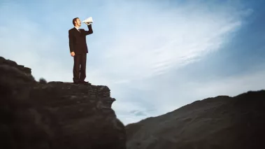 Businessman Shouting Megaphone Top Mountain 