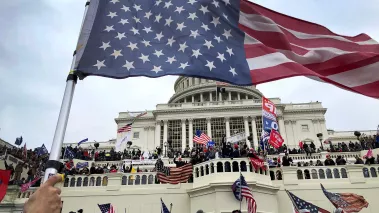 An upside down American flag waves as pro-Trump protestors took over the steps of the Capital in Washington, DC, Wednesday, January 6, 2021 Capitol Takeover