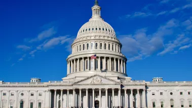 United States Capitol Building with a clear blue sky in the background