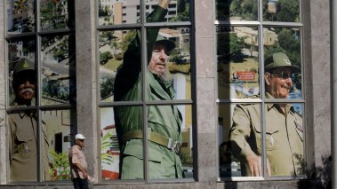 Portrait of Fidel Castro and his brother Raul in the center of the town in Santiago de Cuba