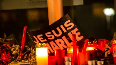 Sign reading Je Suis Charlie at a memorial for the victims of the Charlie Hebdo magazine terror attacks in 2015