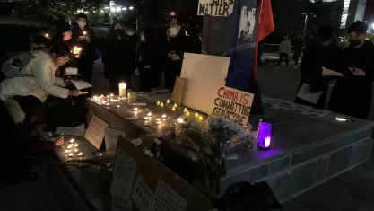 Students at George Washington University take part in protest honoring victims of the Urumqi fire.