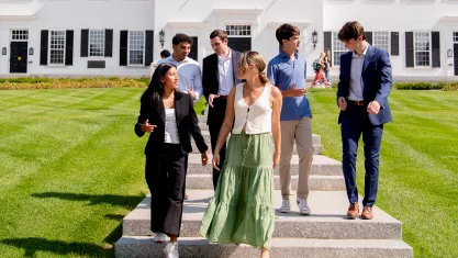 DPU members chat in front of Dartmouth Hall