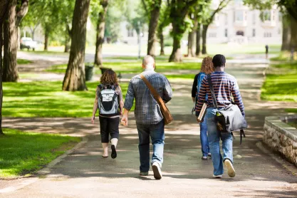 Students walking on campus path