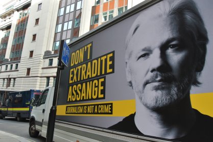 Truck with an image of Julian Assange at his extradition hearing
