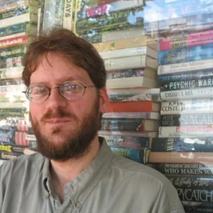 John K. Wilson in front of books