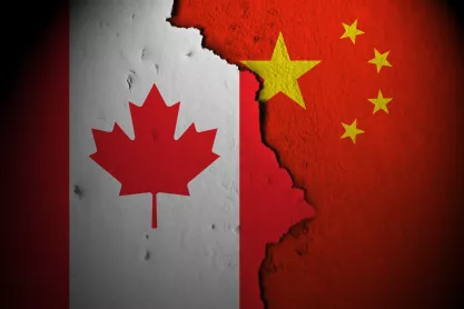 Flags of Canada and China juxtaposted