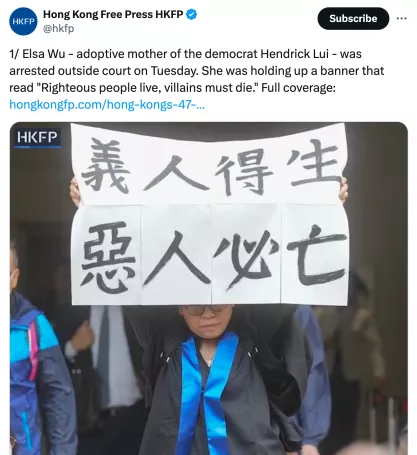 Elsa Wu - adoptive mother of the democrat Hendrick Lui - was arrested outside court on Tuesday. She was holding up a banner that read "Righteous people live, villains must die."