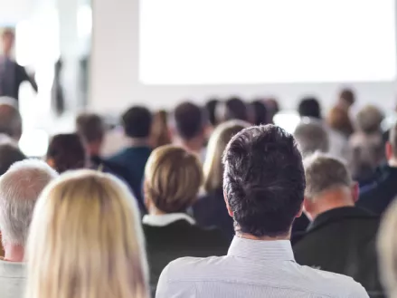 Speaker Giving a Talk at Business Meeting. Audience in the conference hall