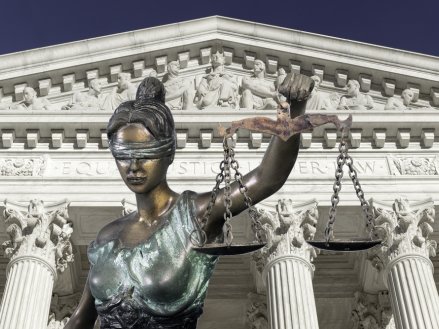 Lady justice against The Supreme court of U.S.