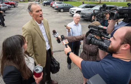 Former UW-La Crosse Chancellor Joe Gow speaks to reporters before disciplinary hearing on June 19 2024