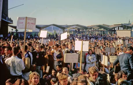 Burton White holds a microphone in front of Sproul Hall on December 3, 1964.