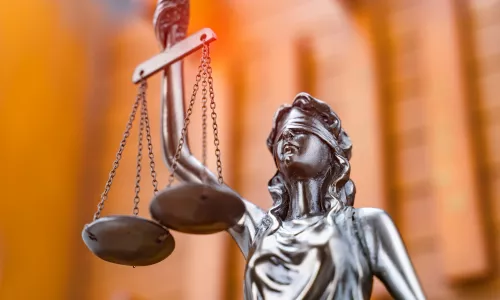 Statue of Justice holding scales