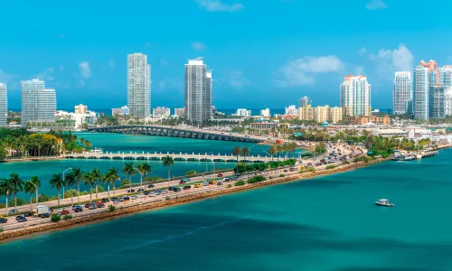 Aerial view of Miami, Florida with the ocean in the foreground.