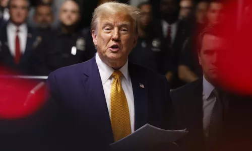 Former U.S. President Donald Trump gives end of the day remarks after exiting the courtroom during his hush money trial at Manhattan Criminal Court on May 14, 2024 in New York City. 