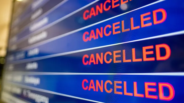 Airport screen indicating cancelled flights