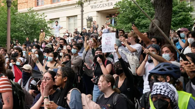 Students watch and participate in a pro-Palestinian protest at the University of Texas Wednesday April 24, 2024