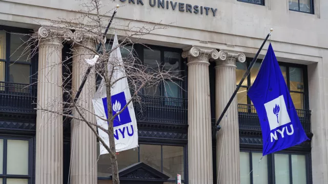 View of a purple school flag on the campus on New York University in Manhattan